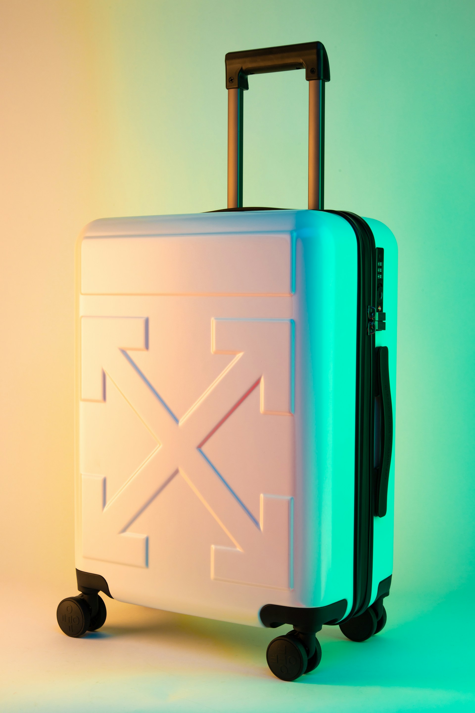 Travelers with rolling luggage in a bright terminal