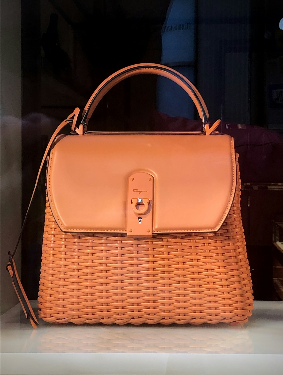Leather handbag detail on neutral background